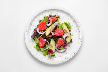Plate with tasty grapefruit salad on white background