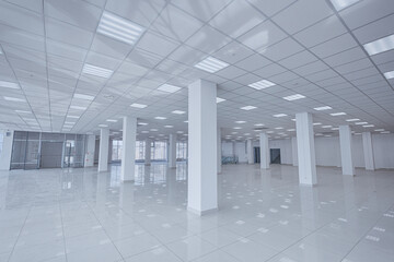 Spotlight and empty space. Empty office space in modern building. Interior of empty unfinished modern market. Architecture concept. Empty white room has white walls. Shopping center