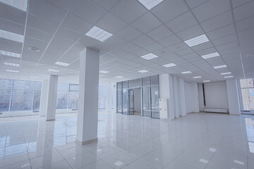 Spotlight and empty space. Empty office space in modern building. Interior of empty unfinished modern market. Architecture concept. Empty white room has white walls. Shopping center
