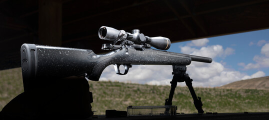 Bolt action rimfire rifle on a shooting bench