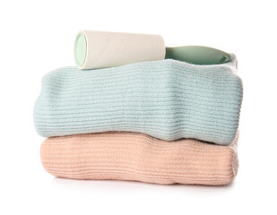 Lint roller with clothes on white background