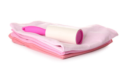 Lint roller with clothes on white background