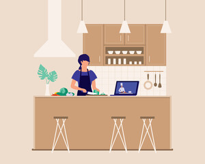 Young Woman With Laptop Learning To Cook While Watching A Online Cooking Tutorial In Kitchen At Home. Online Cooking Class.