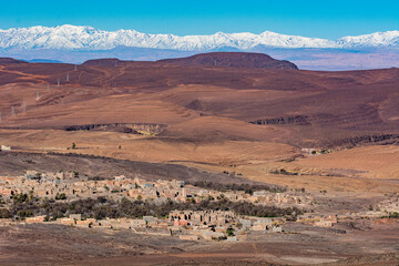A canyon with a mountain in the background
