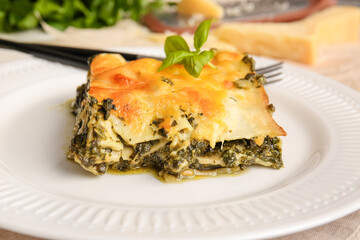 Plate with tasty green lasagna, closeup