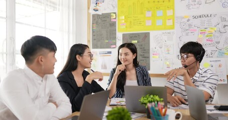 Excited business team giving high five