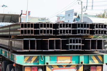i shape steel on truck. ready for transport. iron beam for steel structure.