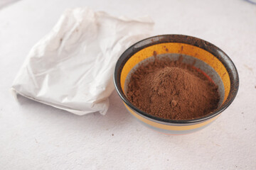 coco powder in a bowl on table,