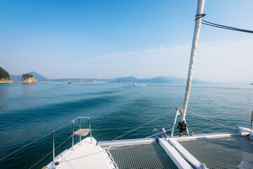 Fototapeta na wymiar Holiday on the motor yacht in the sea with sunset in Busan, South Korea