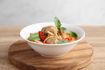Thai chicken and bamboo shoot curry in ceramic bowl