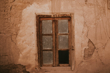 Broken window of old house