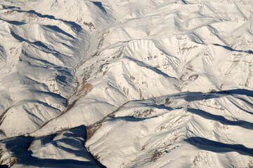 Nature scene - Aerial top view of Snow Mountain of himalaya mountains on sunny day winter season at Leh Ladakh , Jammu and Kashmir , India  - Beautiful White snow nature Texture Background  - obrazy, fototapety, plakaty
