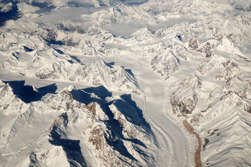 Nature scene - Aerial top view of Snow Mountain of himalaya mountains on sunny day winter season at Leh Ladakh , Jammu and Kashmir , India  - Beautiful White snow nature Texture Background 