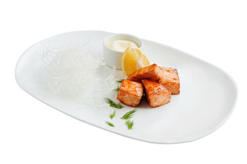 Grilled pieces of salmon on the white plate.