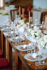 Beautiful table setting for a party, wedding reception or other festive event. Banquet setting, glasses, plates.