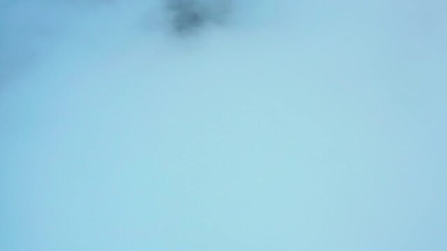 Thick smoke is pouring from the factory chimney.