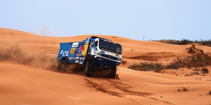 Sports truck KAMAZ gets over the difficult part of the route during the Rally raid in sand. THE GOLD OF KAGAN-2021. 26.04.2021 Astrakhan, Russia