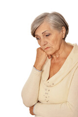 Close up portrait of serious senior woman posing, isolated on white