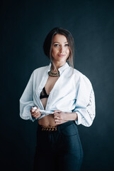 Beautiful young woman in white shirt smiles