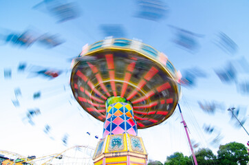 Swing ride in fast speed motion of image at Sydney theme park.