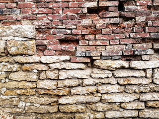 Old crumbling brick wall as an abstract