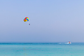 Fototapeta na wymiar Shot of a parasailing close to shore. Activity