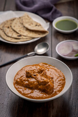 chicken butter masala served with flatbed roti or chapati