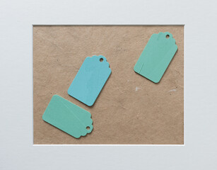 three retro wooden tags on a craft paper background with accent frame