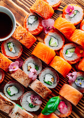 set of sushi roll with salmon, avocado, cream cheese, cucumber, rice, tuna