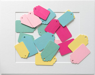 many retro wooden tags on paper background with accent frame