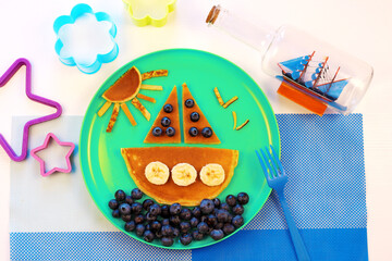 Ship boat pancakes with blueberry. Fun cute food for kids. Breakfast for children	