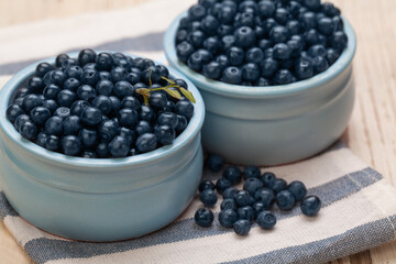 Organic blueberries on wooden board background. Healthy eating