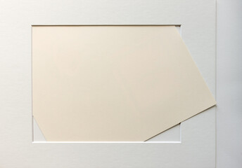 light gray accent frame overlay with textured, used art paper - centre focus on deckle edge - photographed top-down with ambient light 