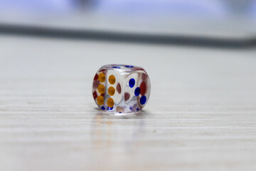 A Dice of Ludo on the table