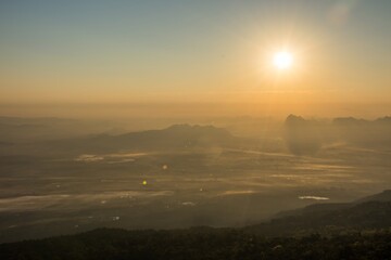 The landscape of nature, mountain and village view of during sunrise taken in Phukradueng, Loey, Thailand . Taken in warm filter and soft focus effect.
