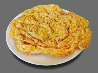 Crispy Omelet on White Plate Isolated on Gray
