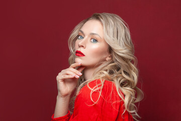 Fashion portrait of stylish woman with perfect makeup. Beautiful model woman with curly hairstyle. Care and beauty, lady in red dress