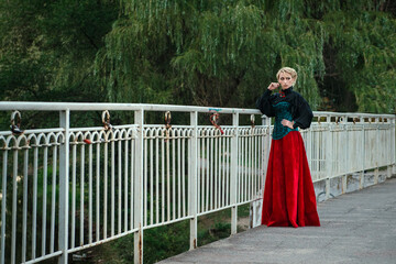 Girl model with white hair in a retro dress with ruffles