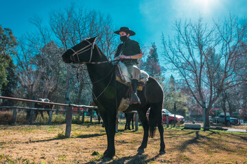 Argentine gaucho riding his horse