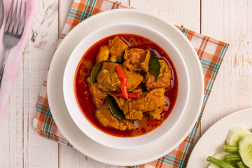 Flat lay Thai pork spare rib curry with southern Thai curry paste, the savory curry without coconut milk in southern Thai food style, often served with vegetables and eaten with plain steamed rice.