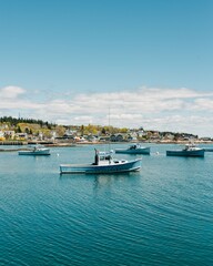 Fototapeta na wymiar Boats in the harbor of the fishing village of Stonington, on Deer Isle in Maine