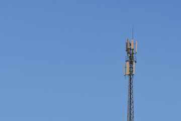 Cell phone signal tower on sky background with copy space Transportation system