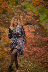 beautiful girl in autumn beautiful foliage in the forest in the tunnel