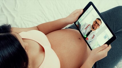 Doctor telemedicine service online video with pregnant woman for prenatal care . Remote doctor...