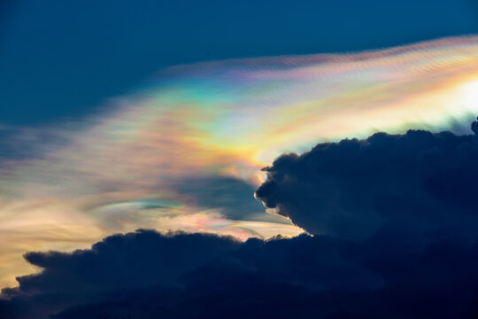 Magical bison cloud formation with rainbow aura.