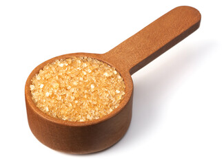 yellow sanding sugar in the wooden measuring spoon, isolated on white background