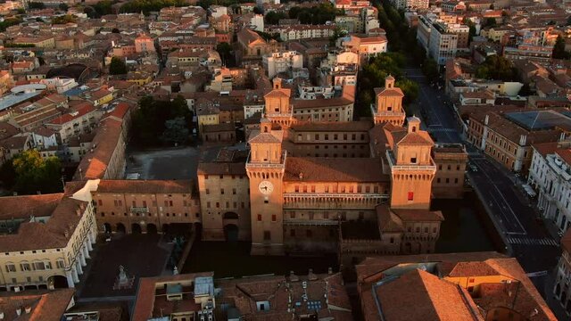 aerial shot drone of ferrara city landmark estense castle at sunrise,flying over town at dawn emilia romagna italy 4k