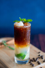 americano black coffee and juice on the wooden background.