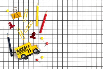 School stationery on checkered white background. Back to school idea