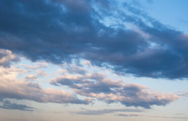 Blue sky background with tiny clouds